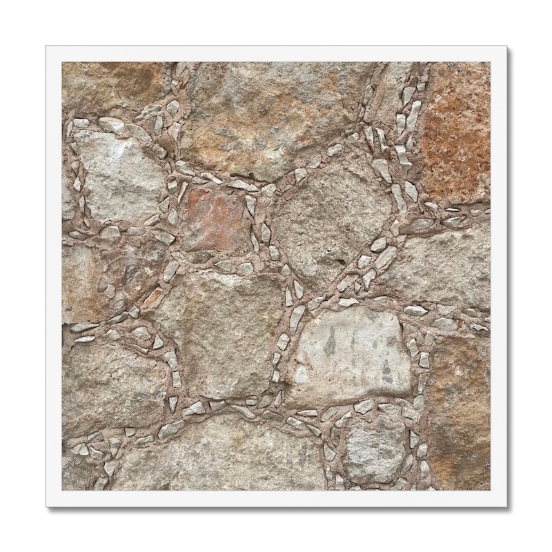 20x20 inch framed photo capturing a natural stone mosaic with smaller stone mortar inclusions, enclosed in a white frame.