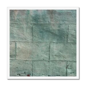 With textured greenish-blue cinder blocks this framed wall photo depicts the fusion of natural and man-made elements.