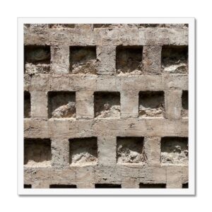 20x20 inch photo in a white frame of a concrete wall with a pattern of square recesses.