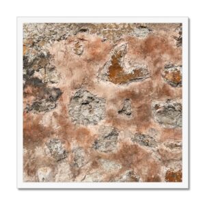 A 20x20" framed print of a Mexican wall texture featuring warm, earthy tones of terracotta and grey.