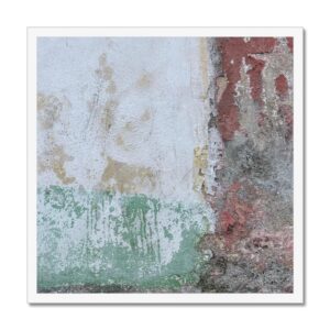 Sections of faded Rastafarian paint colors on a block concrete wall in 20x20” white picture frame.