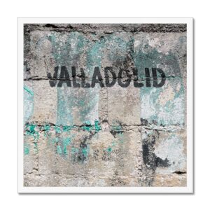 Picture of ‘Valladolid’ hand painted on a weathered concrete wall in Valladolid Mexico, mounted in a white 20x20” frame.